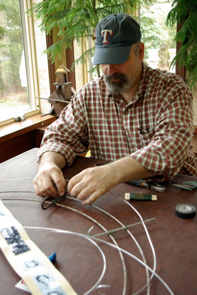Armature. Assistant Tim Kelleher wiring hooks.