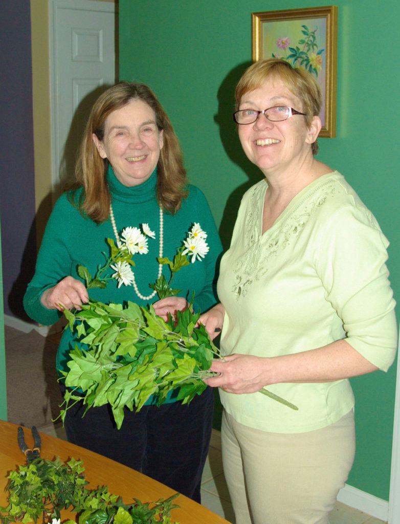 Ivy and Daisy Chain. Phyllis Egan Beals, Smith 1978, and sister, Beth, cut up plastic flowers.